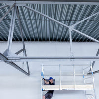 Rolsteiger Alumexx Light 135x250 11,2m werkhoogte tegen de gevel